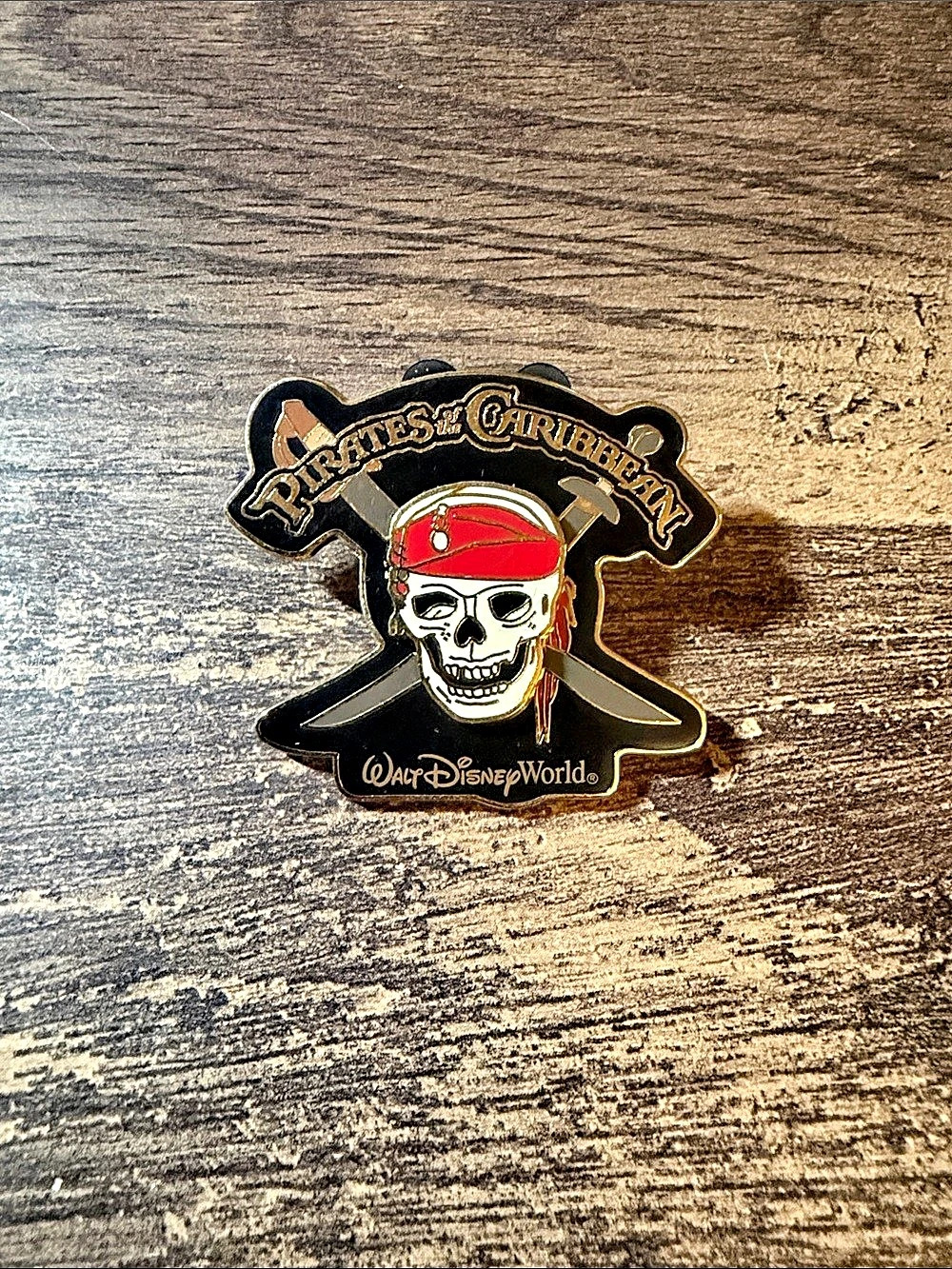 Disney Pirates of the Caribbean Skull and Crossbones Pin Black & Gold